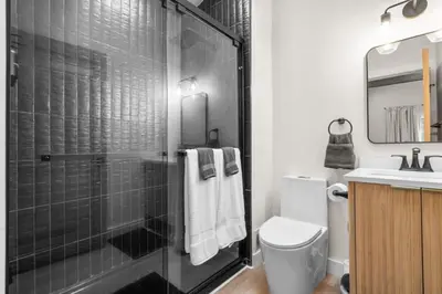 a bathroom with a shower and a toilet and a sink at 37 - Luxury Collection in Stratford