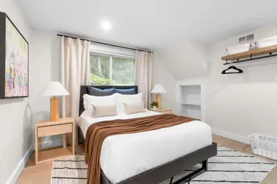 a bedroom with a large bed and a window at 37 - Luxury Collection in Stratford