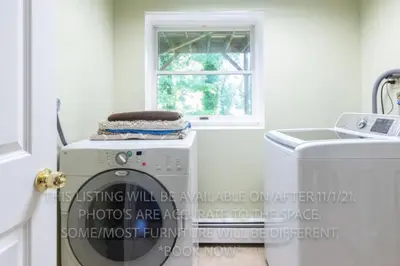 a laundry room with a washing machine and a window at 16 A COZY GETAWAY 4BED 3BATH HOME W FIRE PIT in Southington