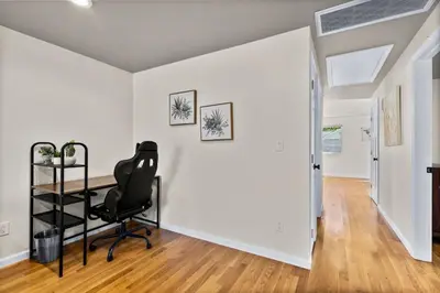 an empty room with a desk and a chair at 26 Beautifully Renovated 2 BR Home in Plainville
