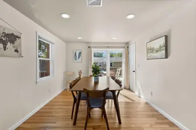 a dining room with a table and chairs at 26 Beautifully Renovated 2 BR Home in Plainville