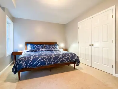 a bedroom with a bed and a white door at 11 - 4 Bedrooms 3 Baths Sleeps up to 10 in Plainville