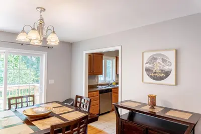 a kitchen and dining room with a table and chairs at 11 - 4 Bedrooms 3 Baths Sleeps up to 10 in Plainville