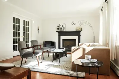 a living room with a couch and a fireplace at Beautifully Designed 4BR Home Heated Pool HotTub in Valatie