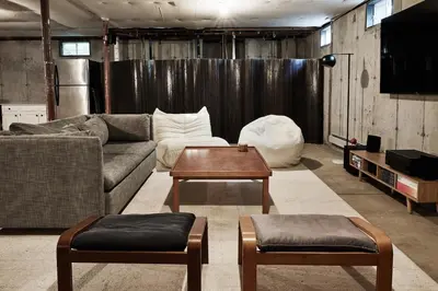 a living room with a couch and a table at Beautifully Designed 4BR Home Heated Pool HotTub in Valatie