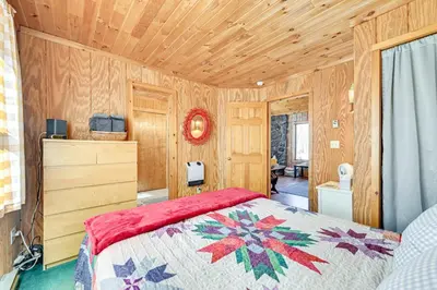 a bedroom with a bed and a wooden ceiling at 3 Mi to Catskill Trail Stamford Cottage with Views in Stamford