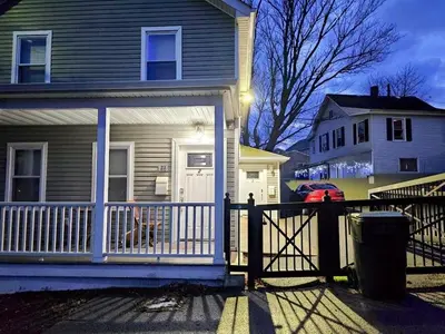 a house with a white gate and a fence at Walk to WP Gate and Free Parking in Highland Falls