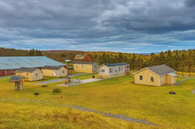 an aerial view of a farm with houses and trees at Farm Stay Close to Ski Adventures in Pleasant Mount