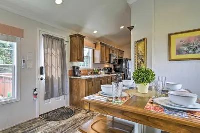 a kitchen with a table with dishes on it at Vacation Cottage Getaway Close to Ski Resorts in Pleasant Mount