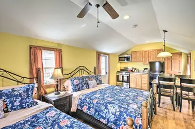 a bedroom with two beds and a kitchen at 12 Bedroom Estate Experience 100 Acre Near Ski Area in Pleasant Mount