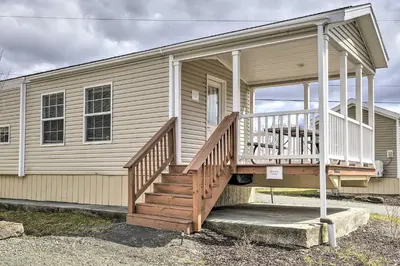 a house with a porch and a staircase on it at 12 Bedroom Estate Experience 100 Acre Near Ski Area in Pleasant Mount