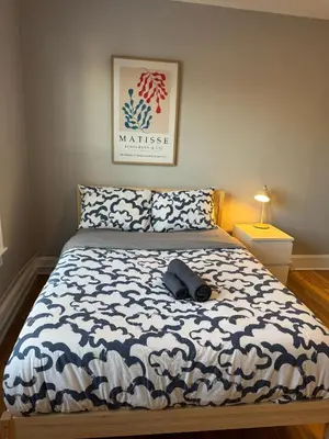 a bedroom with a bed with a blue and white blanket at Private room in a shared apt Middletown near Wesley uni in Middletown