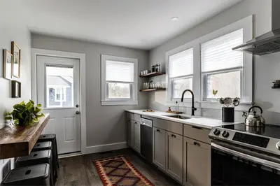 a kitchen with a sink and a stove at Perch Cottages #9 - Creek Access, Sauna, Mt views in Boiceville