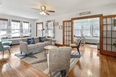 a living room with a couch and a table at Grove Place Beach West Haven in West Haven