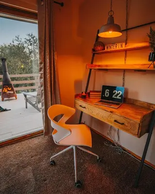 an office with a desk and a chair and a clock at Idyllic Mountain Stay Hot Tub, Wood Stove, Games in Windham
