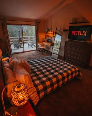 a living room with a couch with a checkered blanket at Idyllic Mountain Stay Hot Tub, Wood Stove, Games in Windham