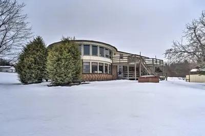 a large house in the snow with a yard at Idyllic Mountain Stay Hot Tub, Wood Stove, Games in Windham