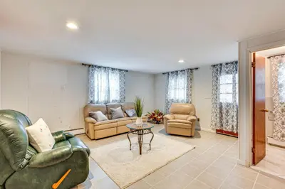 a living room with couches and chairs and a table at Work, Explore and Relax Centrally Located Union Gem in Union