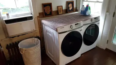 a washer and dryer in a kitchen with a window at Historical Home with Amenities Nearby - Delaware River, General Store, Post Office, Tavern in Equinunk