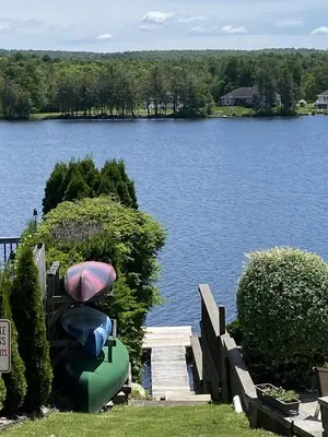a view of a lake with a boat on a dock at Newton Lake in Malinchak Airport