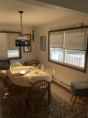 a kitchen with a table and chairs and a dining room at Great Value - Oceanside Raised Ranch Location Is Perfect For Walking To Beach, Restaurants, Pizza, Ice Cream Or Coffee 13419 in Upper Greenwood Lake