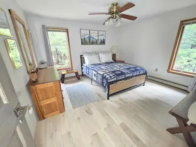 a bedroom with a bed and a ceiling fan at Kaaterskill Waterfall House in Haines Falls
