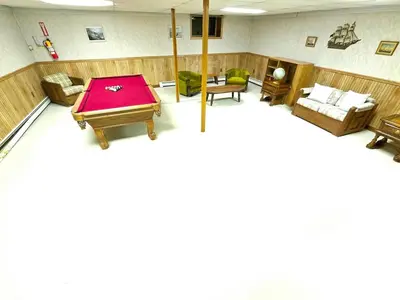 a large room with a pool table in it at Kaaterskill Waterfall House in Haines Falls