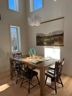 a dining room with a wooden table and chairs at Cozy Cabin with Fireplace, Games, Coffee on 5 Acres in Hunter