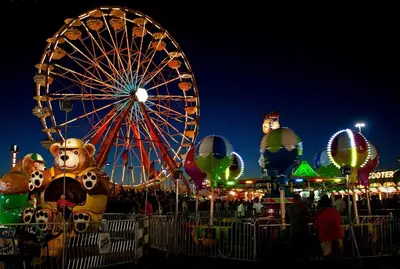 a ferris wheel at a carnival at night at The Woodridge Retreat in Goshen