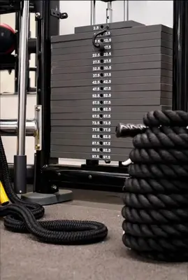a stack of black cords on the floor next to a machine at NEW Chic & Cozy 1BD Apartment Near East River, Minutes from Central Park in New York