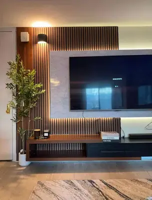 a living room with a large flat screen tv at NEW Chic & Cozy 1BD Apartment Near East River, Minutes from Central Park in New York