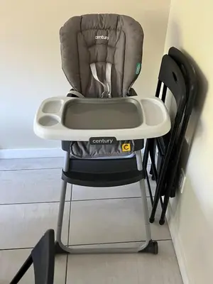 a high chair sitting next to a wall at Spacious and tranquil 5br house in charming East Stroudsburg w game room, pets allowed in East Stroudsburg