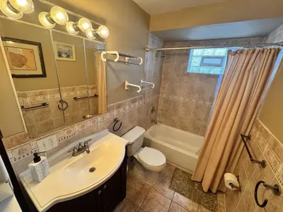a bathroom with a sink and a toilet and a shower at Ultra Spacious Penthouse - Apt 2 - 3 Combo -15 Mins from NYC in Union City