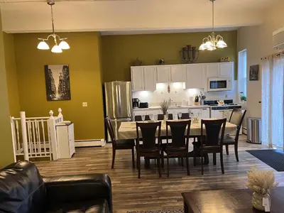 a dining room and kitchen with a table and chairs at Mega Trade Stunning View - APT 3-4 Combination in Union City
