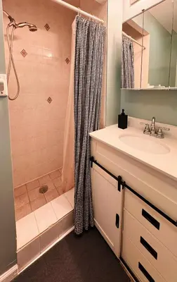 a bathroom with a shower and a sink at Mega Trade Stunning View - APT 3-4 Combination in Union City