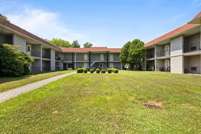 an empty lawn in front of a building at Chic New York Studio with Kitchen in Hyde Park
