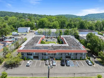 an aerial view of a parking lot in front of a building at Chic New York Studio with Kitchen in Hyde Park