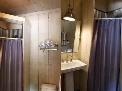 a bathroom with a shower toilet and a sink at Glamorous Cottage Rental with Outdoor Lounge and Pool on 40 Acres in Pine Bush, New York in Pine Bush