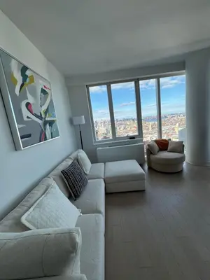 a living room with a couch and two couches and windows at Luxury 2 bedrooms 2 bathrooms Corner Apartment Breathtaking City Views Modern Retreat in Sunnyside