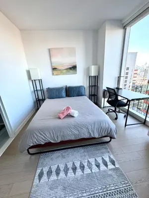 a bedroom with a bed with a pink bow on it at Luxury 2 bedrooms 2 bathrooms Corner Apartment Breathtaking City Views Modern Retreat in Sunnyside
