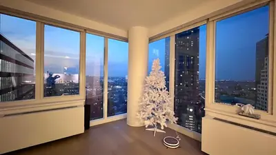 a room with a christmas tree in a room with windows at Luxury 2 bedrooms 2 bathrooms Corner Apartment Breathtaking City Views Modern Retreat in Sunnyside