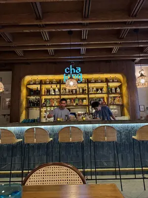 two people standing at a bar in a restaurant at Midtown High Floor Fantastic Panoramic City View Corner 2 Bedroom Apartment in New York