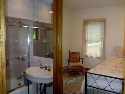 a bathroom with a sink and a shower and a tub at Lovely Cottage Getaway in the Mountains near Phoenicia, New York in Chichester