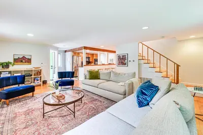 a living room with a couch and a table at 8 Mi to Tanglewood and Butternut Ski Spacious Home! in Housatonic