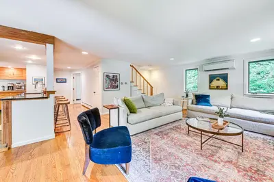 a living room with a couch and a table at 8 Mi to Tanglewood and Butternut Ski Spacious Home! in Housatonic