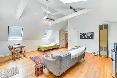 a living room with a couch and a table at 8 Mi to Tanglewood and Butternut Ski Spacious Home! in Housatonic