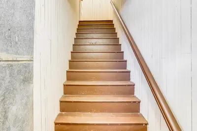 a set of stairs in a building at Walk to Dtwn Hudson Cozy Upstate Apartment in Hudson