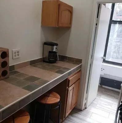 a kitchen with a counter top and a coffee maker at Great Looking Studio Apartment in New York