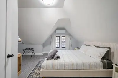 a bedroom with a bed in a attic at 2 Bed Apt in BlackRock by beach in Bridgeport