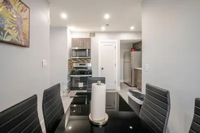 a kitchen with a dining room table and chairs at 2 Bed Apt in BlackRock by beach in Bridgeport